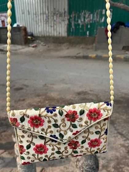 This is one of the embroidered sling bags I found in Delhi. The colourful floral embroidery and beaded strap make it a really unique and beautiful accessory.