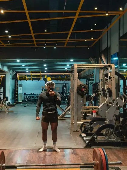 A full-body shot in the gym after a hard workout. This is the lean strength look we aim for: muscular, defined, and athletic.