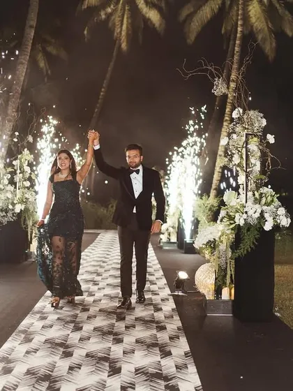 Their classy and elegant vibe shone brighter than the sky as they walked hand in hand. This entry was all about them, with a path lit by cold pyros creating a magical walkway.