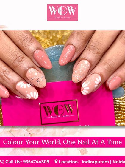 A sweet and fresh design featuring a peach-colored base with sparkling accents and hand-painted white daisies. A perfect look for spring and summer.