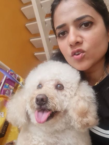 A selfie with a sweet Poodle client. I love getting to know all the wonderful pets that visit us.