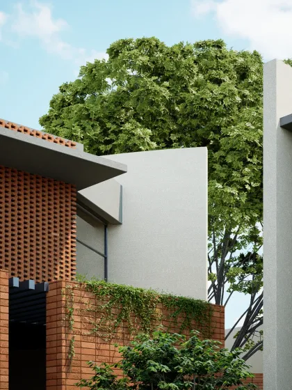 A detail of the TheraNym office facade, where textured brickwork is contrasted with smooth plaster and lush greenery. The design aims to create a building that feels both monumental and connected to nature.