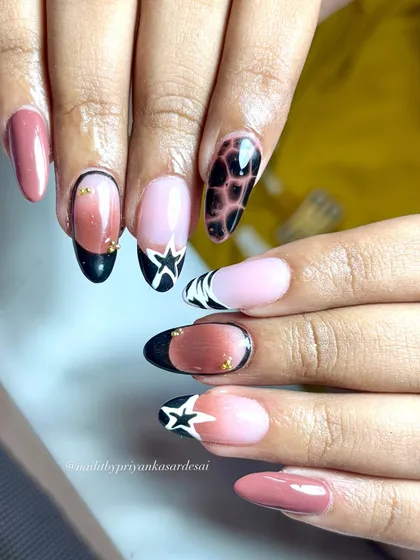 Stars, ombré, and tortie vibes, this set is everything. A creative and edgy mix of different nail art styles that somehow work perfectly together.