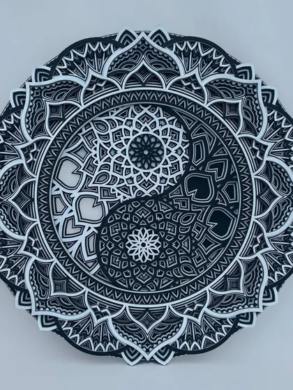 Find balance and serenity with our handmade wooden Yin Yang mandala. This spiritual wall decor features multiple layers of intricate patterns, creating a beautiful play of shadow and light that adds a peaceful, harmonious touch to your home.