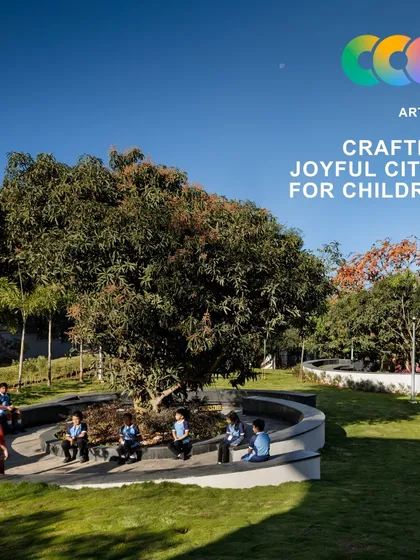 An article exploring how thoughtful urban planning can create safe, inclusive environments for children. The image shows a simple, effective outdoor seating area that encourages social interaction and learning in a natural setting.