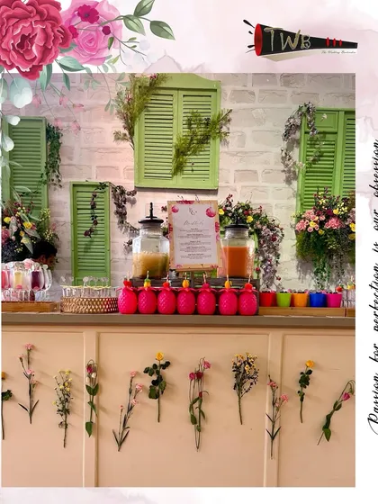 A charming and rustic floral bar setup for a Haldi ceremony at Della Resorts, Lonavala. The design incorporates natural elements, fresh flowers, and vibrant colors to create a cheerful and welcoming vibe.