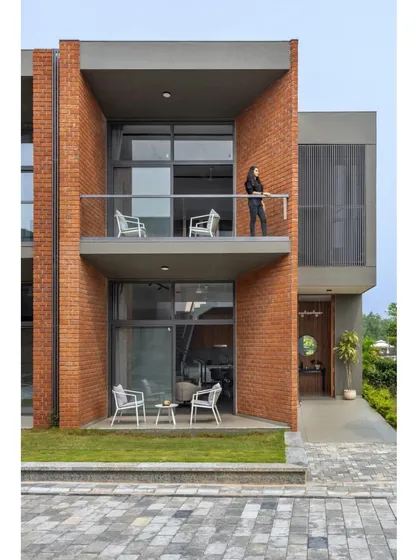 The 'SWAJAN Community' in Vadodara is a rehabilitation center that combines brick and concrete to create a modern and dignified healthcare environment.