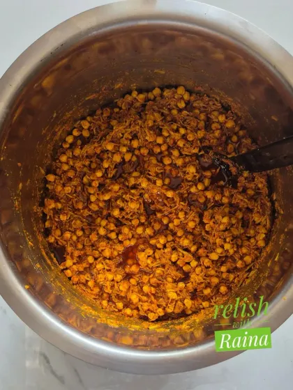 This bowl shows the Chana Kairi pickle mix before the oil is added. You can see the soaked chickpeas mixed with grated raw mango and dry spices. It's a flavour that is both unique and traditional.