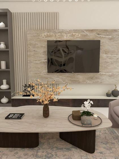 Another view of the TV and seating area. The design is modern, luxurious, and perfect for entertaining.