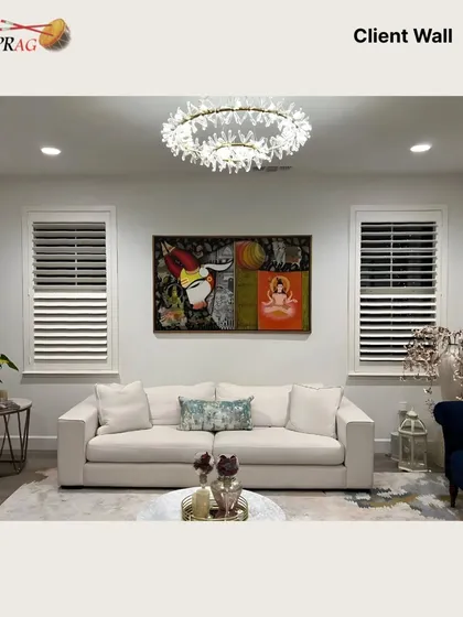 A vibrant mythological painting featuring Nandi and Lord Shiva becomes a powerful statement piece in this modern living room, beautifully centered between two windows.