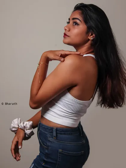 A profile shot of the same look, highlighting the model's features and the simplicity of the styling.