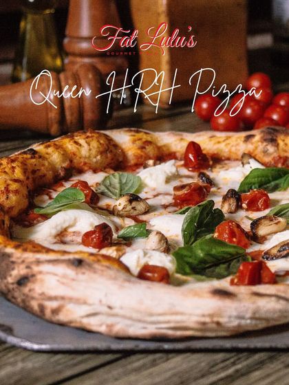 Bow down to the Queen HRH Pizza, one of our most-ordered gourmet pies. It features fresh mozzarella, roasted cherry tomatoes, wild mushrooms, and basil on a perfectly baked Neapolitan crust.