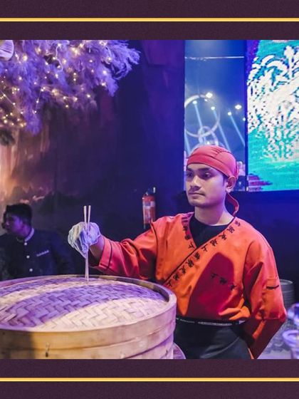 An expert from our team prepares fresh dim sum. Our live stations feature a variety of global cuisines, bringing diverse and authentic flavors directly to your event.