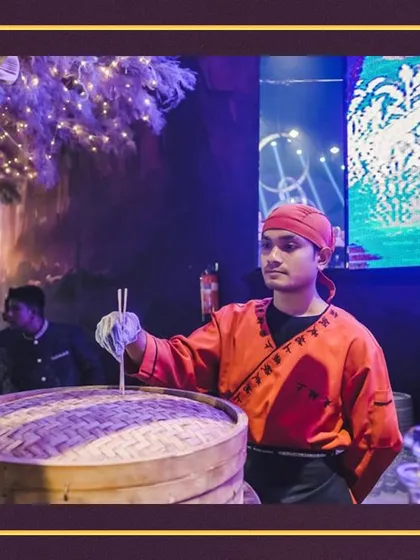 An expert from our team prepares fresh dim sum. Our live stations feature a variety of global cuisines, bringing diverse and authentic flavors directly to your event.
