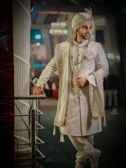 A stylish, full-length portrait of the groom. We used creative lighting to create a vignette effect, making him the sole focus of this powerful image.