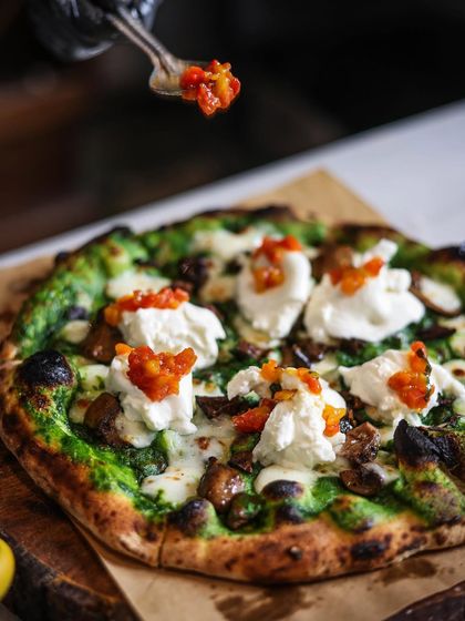 Starting the weekend off right with lots and lots of pizza. This one, with a vibrant spinach cream base, mushrooms, and dollops of burrata, is a vegetarian dream.