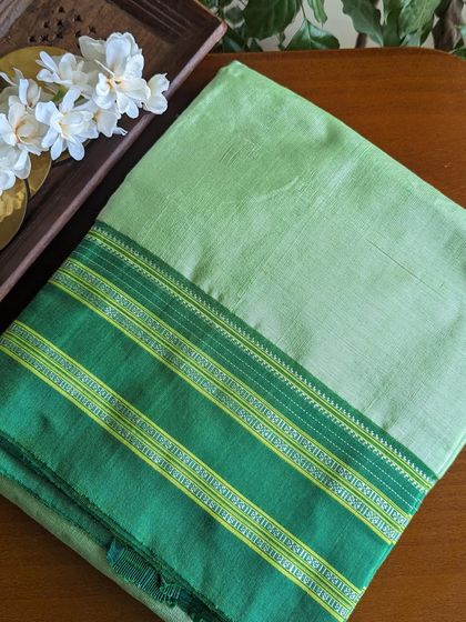 A soft pastel green Ilkal saree with a darker green border. This is a more subtle and understated option from our Ilkal collection.