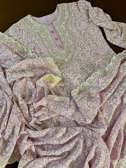 A complete look at the lilac ensemble, showing the kurta, dupatta, and coordinated lower piece.