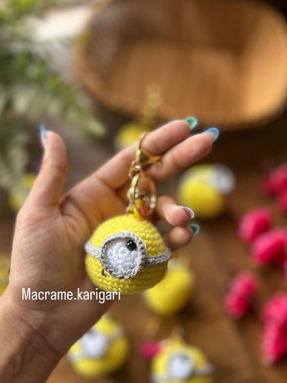 Holding one of our minion keychains to show its size. It's a perfect little buddy to hang on your backpack or keys.