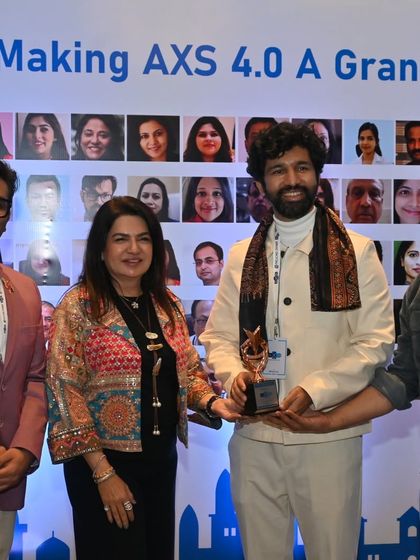 Receiving an award at AXS 4.0. I am grateful for the opportunity to contribute to discussions that keep patient selection, safety, and outcomes at the core of our practice.