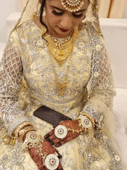 A beautiful bride surrounded by her loved ones. I also did the henna for her family and friends, ensuring everyone had beautiful hands for the photos.