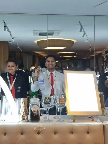 Another look at our professional team with the versatile beige tufted bar, ready to serve.