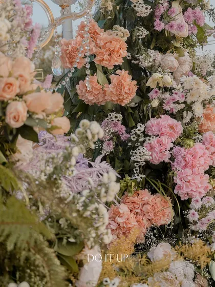 A close-up of the dense and textural floral arrangements from the Udaipur wedding. The mix of hydrangeas, roses, and other blooms in soft pastel shades creates a breathtakingly lush effect.