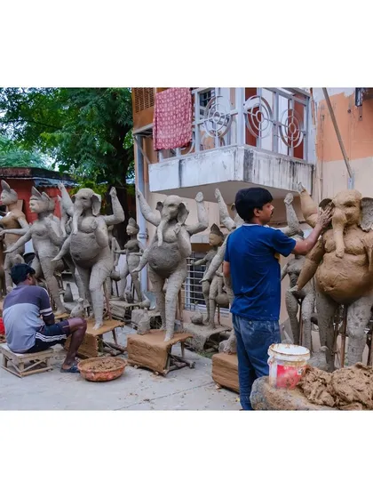 The workshops of idol makers are filled with figures of gods and goddesses in various stages of completion, a testament to the scale of Durga Puja preparations.