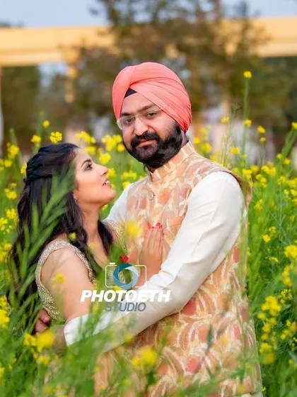 A classic and romantic pre-wedding portrait set in a beautiful field of yellow flowers. Natural light and a stunning outdoor location are sometimes all you need to capture the simple joy and love between a couple.