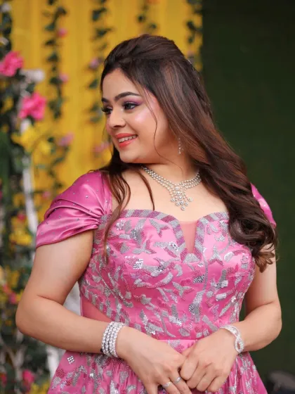 This bride-to-be is a real-life fairytale princess. Her soft glam makeup features dewy skin, fluttery lashes, and a pop of pink.