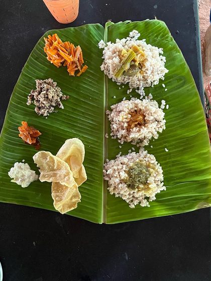 A simple, nourishing satvic meal served on a traditional banana leaf. Food is an essential part of our wellness journey, prepared with love to support your body and soul.