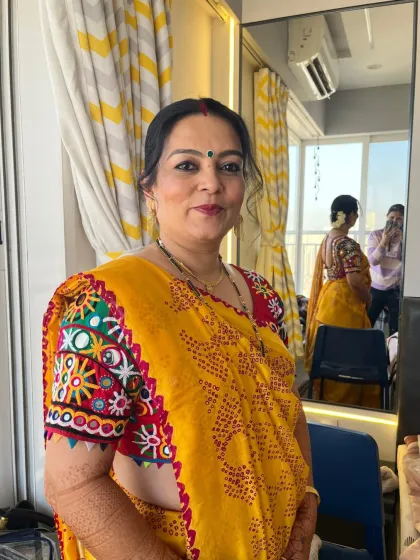 A beautiful look for the Mandava Murat ceremony. The groom's mom is glowing with pride in a traditional Gujarati saree.