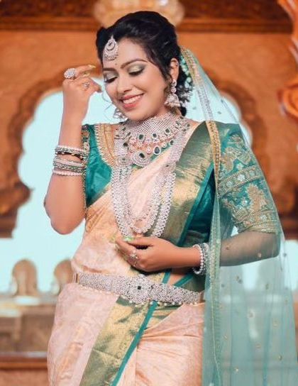 A candid moment, showing the sparkle and detail of our emerald and diamond-look reception jewellery.