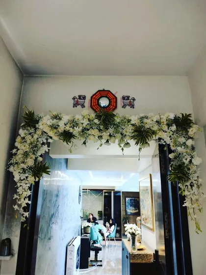 Even simple home celebrations deserve a special touch. We designed this lush floral arch to frame the doorway of a home, creating a festive atmosphere for a family gathering.
