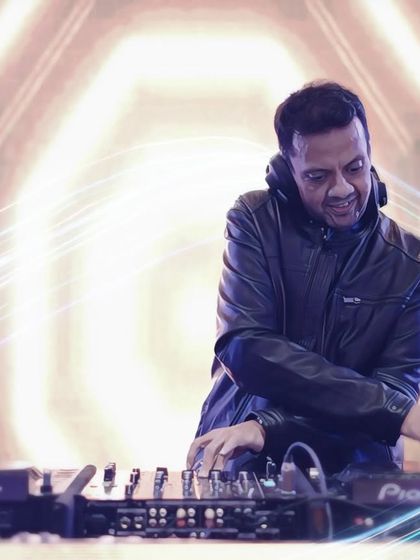 A creative shot of me at the console. I believe a great DJ makes people happy, and seeing the joy on their faces when they hear a song they love is the best feeling.