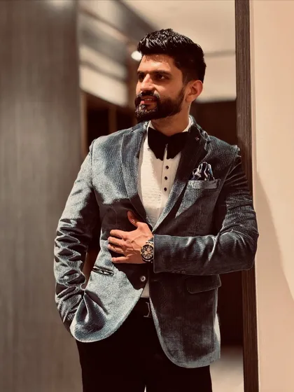 A sharp, formal look with a velvet blazer and a bow tie, perfect for a sophisticated evening event.
