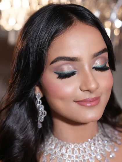 This is one of my favorite ways to make a look pop on camera. I created this sharp, emerald winged liner and paired it with soft, shimmery lids to create a perfect balance of softness and statement. This kind of detailed eye makeup photographs beautifully for fashion and beauty editorials.