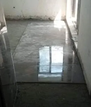 A snapshot of the flooring work in progress at our Unitech Cascades site. The reflection on the newly laid tile shows the quality and precision we aim for in our civil work.