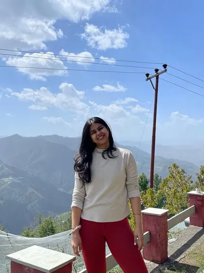Posing against the stunning Himalayan landscape. The mountains provide a powerful and inspiring backdrop for our practice.