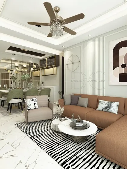 We used a bold, abstract art piece as the focal point behind the sofa in this living room. The L-shaped couch provides ample seating, and the striped rug helps define the seating area within the open-plan space.