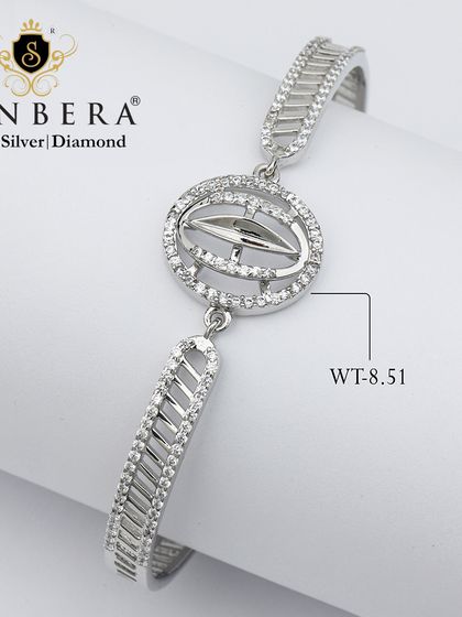 This 8.51-gram silver bracelet features a unique charm with an arrow or compass-like design, making it a signature piece of elegance for the modern wearer.