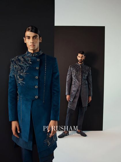 Meticulously hand-embroidered, these ensembles in deep blue and grey boast luxurious details. The asymmetrical cuts and rich fabrics embody sophistication.