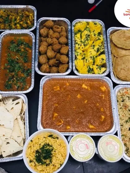For clients who prefer to manage their own service, we offer bulk food delivery. This order showcases a complete party menu, including Paneer Butter Masala, Dal, Pulao, and more, all packed in convenient foil trays.