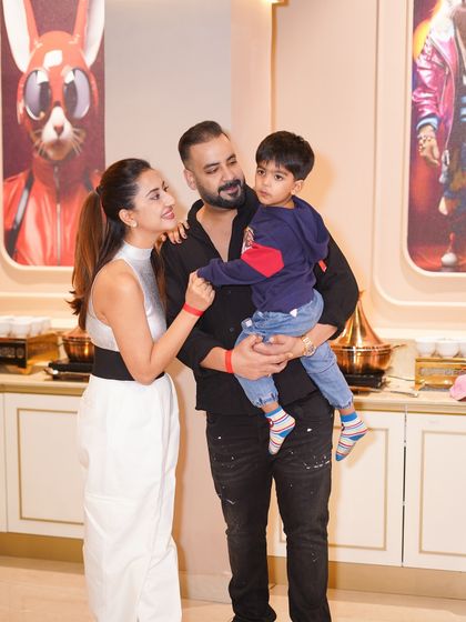 A beautiful family portrait at their son's superhero-themed birthday party. We provide a premium setting for capturing these important family milestones.