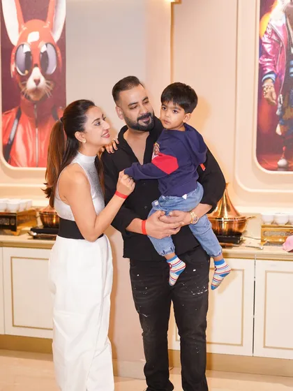 A beautiful family portrait at their son's superhero-themed birthday party. We provide a premium setting for capturing these important family milestones.