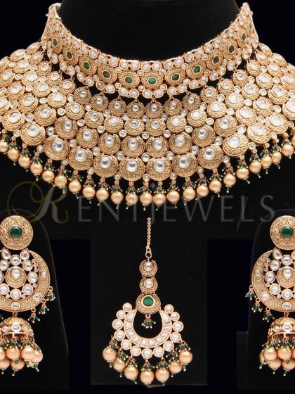 My satin gold-plated choker necklace set gives you the look of real gold jewelry. This full bridal set is a classic choice that looks incredibly close to the real thing.