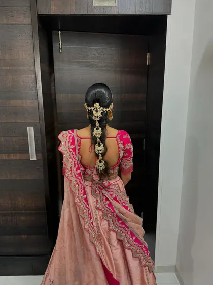 Another view of this regal bridal braid, a perfect choice for a grand wedding look.