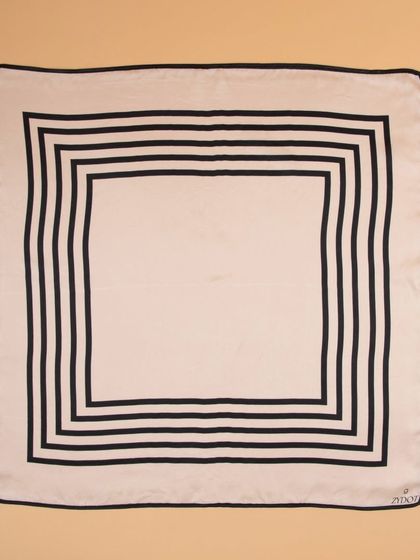 A flat-lay of the geometric black and white striped pocket square.