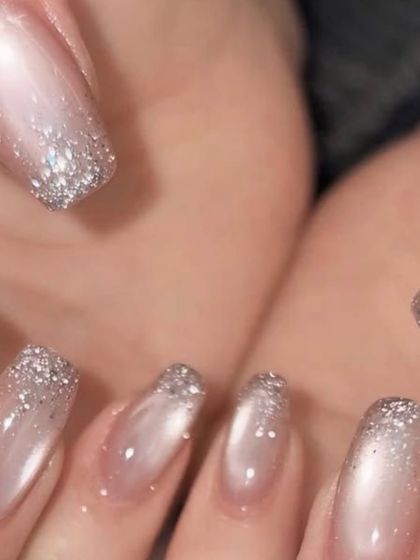 I had the pleasure of creating these cat-eye nails with glitter tips for Nupur Sanon on her big day. This design offered a beautiful blend of modern trend and bridal sparkle.