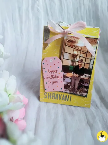 Another view of the personalized birthday tag book, tied with a pretty pink ribbon.